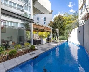 Swimming pool of Duplex for sale in  Madrid Capital  with Air Conditioner, Heating and Private garden