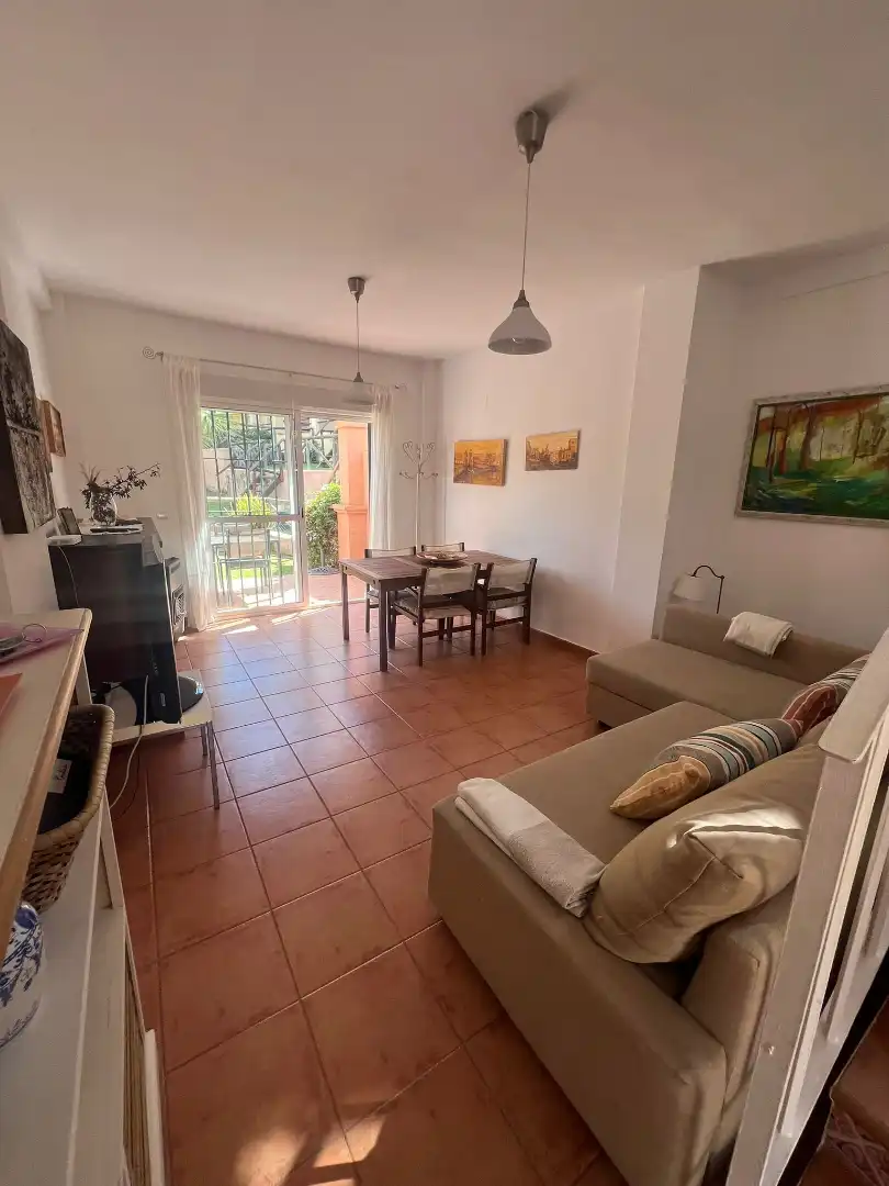 Sala de estar de Casa adosada en venta en Islantilla con Jardín privado, Trastero y Piscina comunitaria
