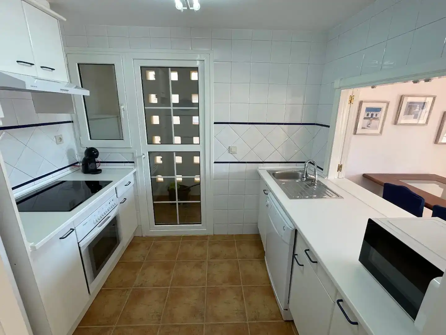 Kitchen of Flat for rent in Ayamonte  with Air Conditioner, Private garden and Parquet flooring