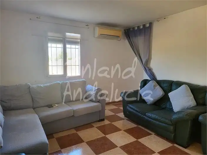 Sala de estar de Casa adosada en venta en Mollina con Aire acondicionado y Terraza