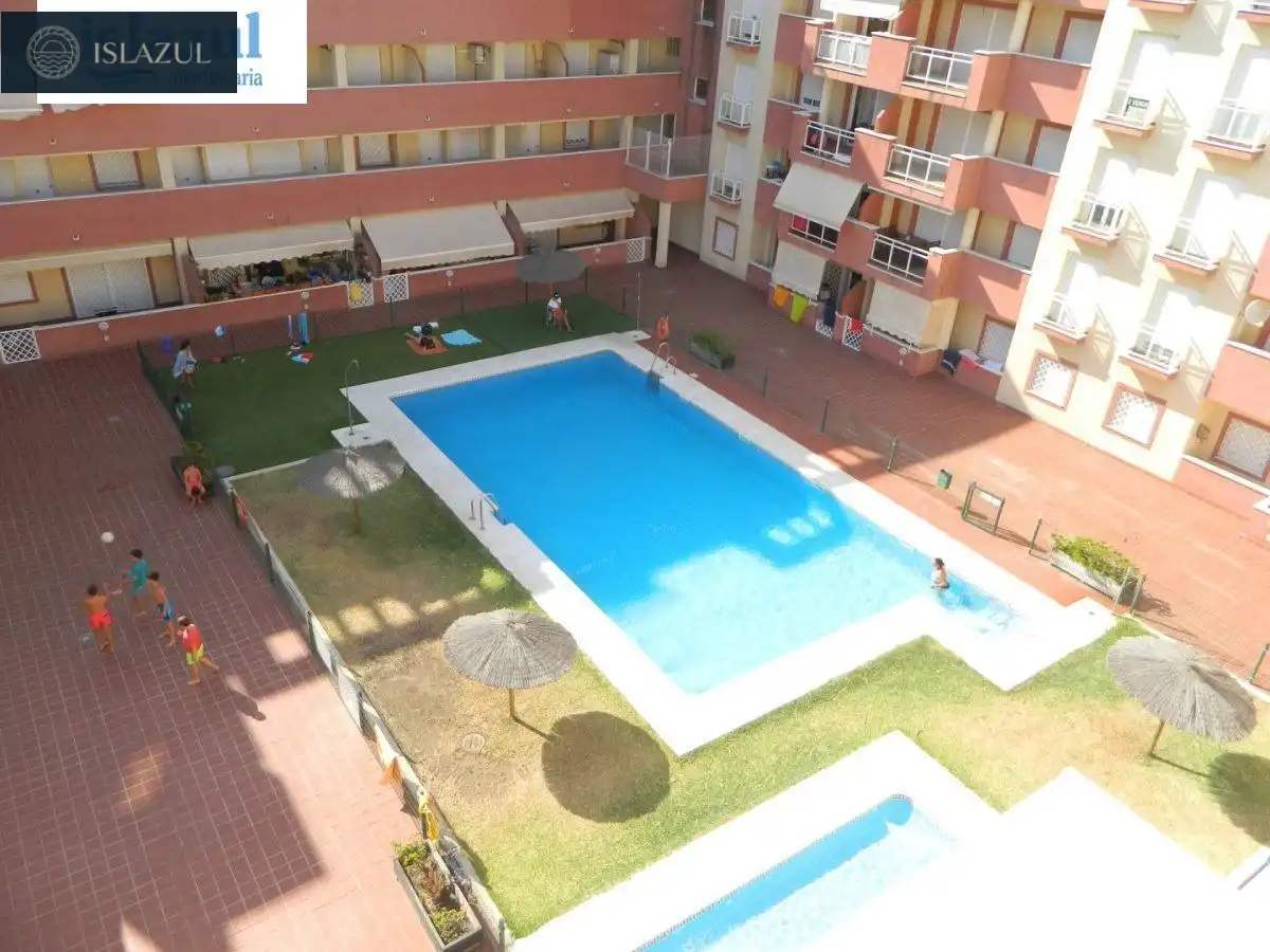 Piscina de Dúplex de alquiler en Isla Cristina con Terraza, Balcón y Piscina comunitaria