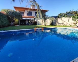 Swimming pool of Single-family semi-detached for sale in Nigrán  with Heating, Private garden and Parquet flooring