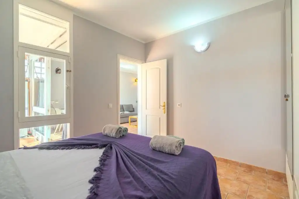 Schlafzimmer von Wohnungen zum Verkauf in Arona mit Privatgarten, Terrasse und Möbliert
