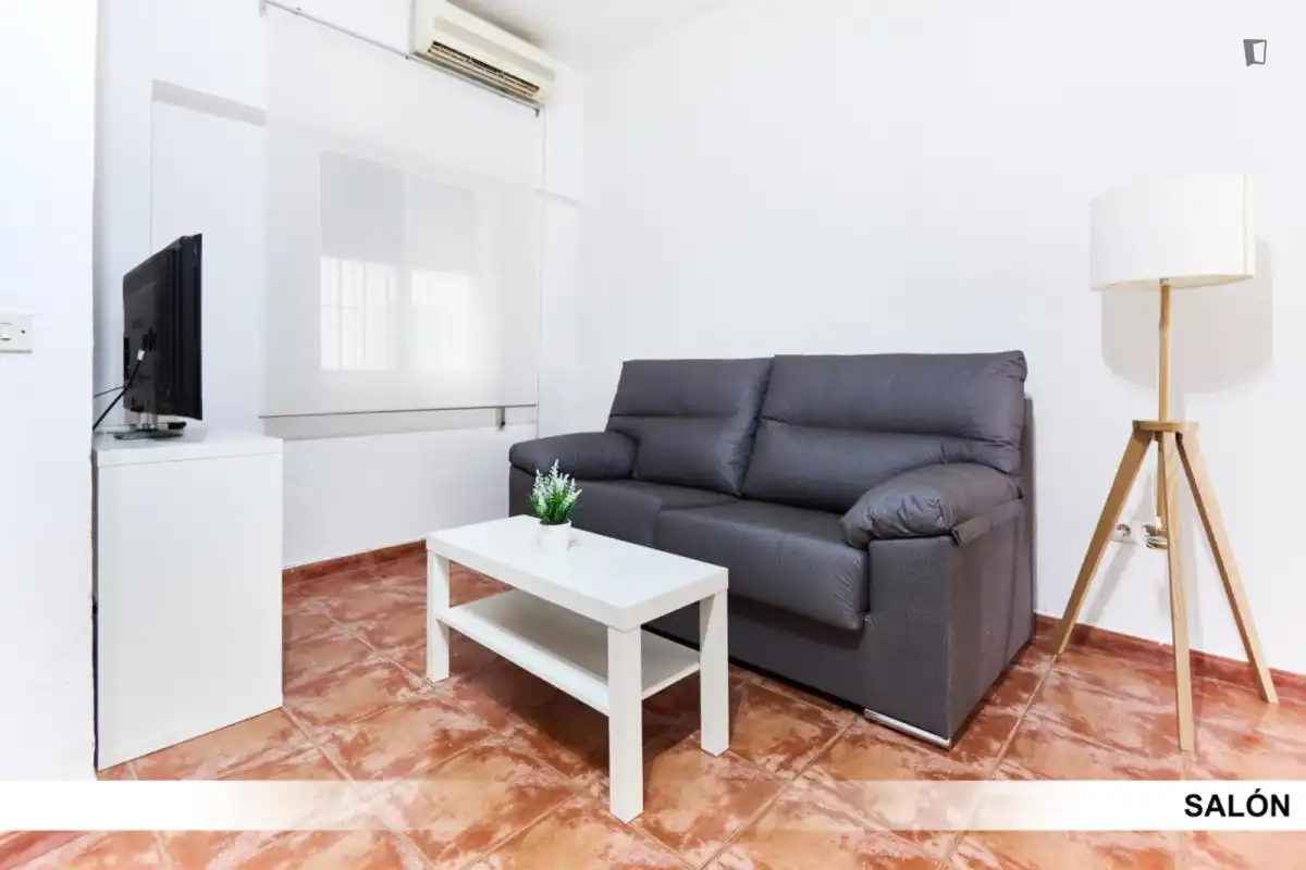 Sala d'estar de Apartament per a compartir en Alcalá de Guadaira amb Aire condicionat, Calefacció i Moblat