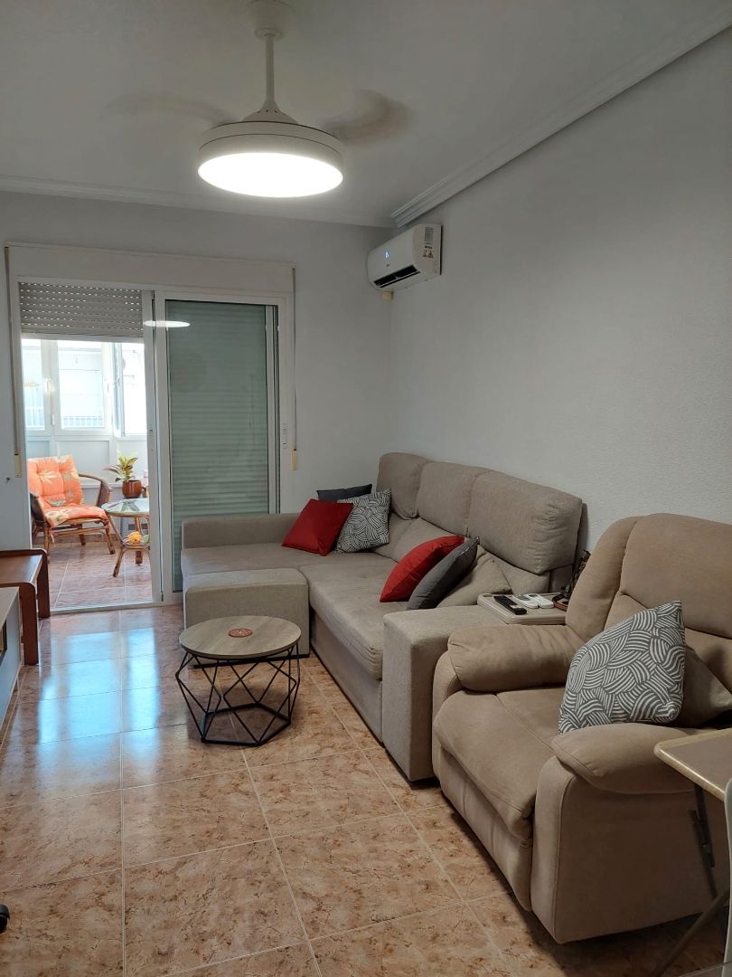 Living room of Flat for sale in Torrevieja  with Air Conditioner, Furnished and Balcony
