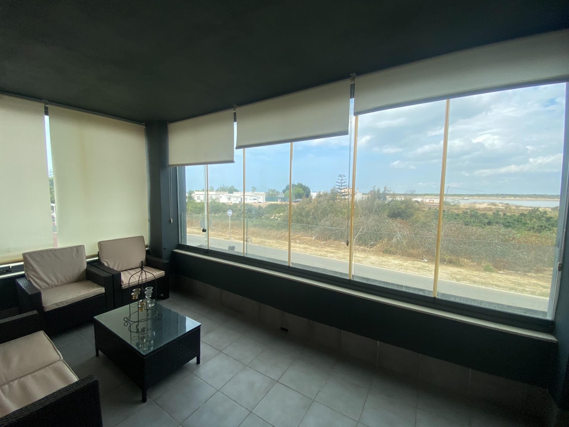 Living room of Flat for sale in Sanlúcar de Barrameda  with Air Conditioner, Private garden and Terrace