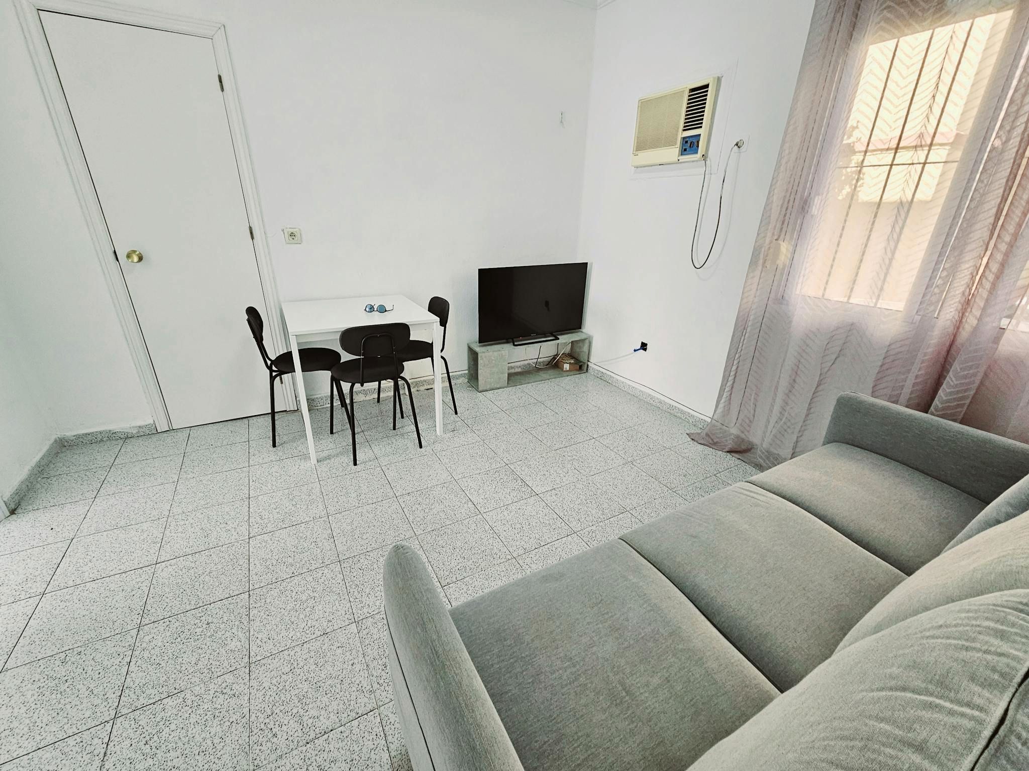 Sala d'estar de Pis per a compartir en  Sevilla Capital amb Aire condicionat, Moblat i Rentadora