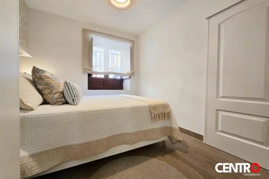 Dormitori de Apartament de lloguer en Granada amb Aire condicionat