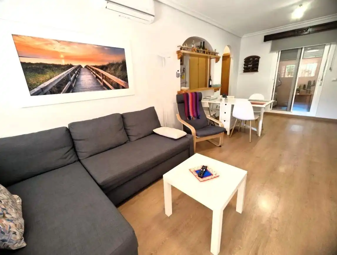 Sala de estar de Casa adosada de alquiler en Santa Pola con Aire acondicionado, Calefacción y Parquet