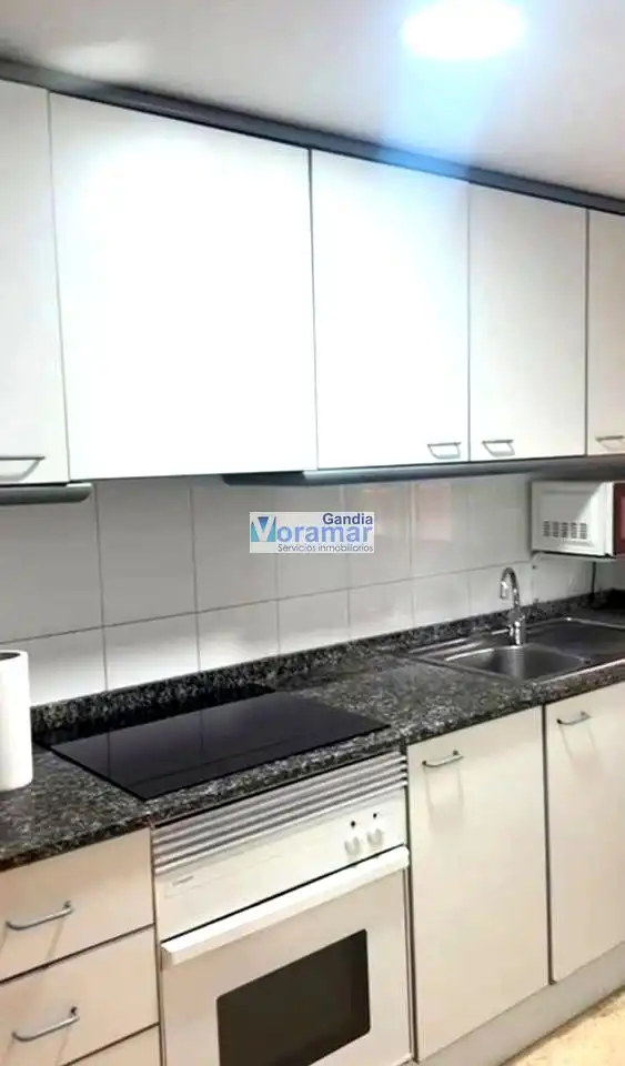 Cuina de Apartament en venda en Gandia amb Aire condicionat, Jardí privat i Terrassa