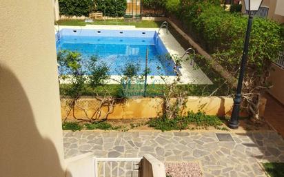 Swimming pool of Duplex for sale in Roquetas de Mar  with Air Conditioner, Heating and Terrace