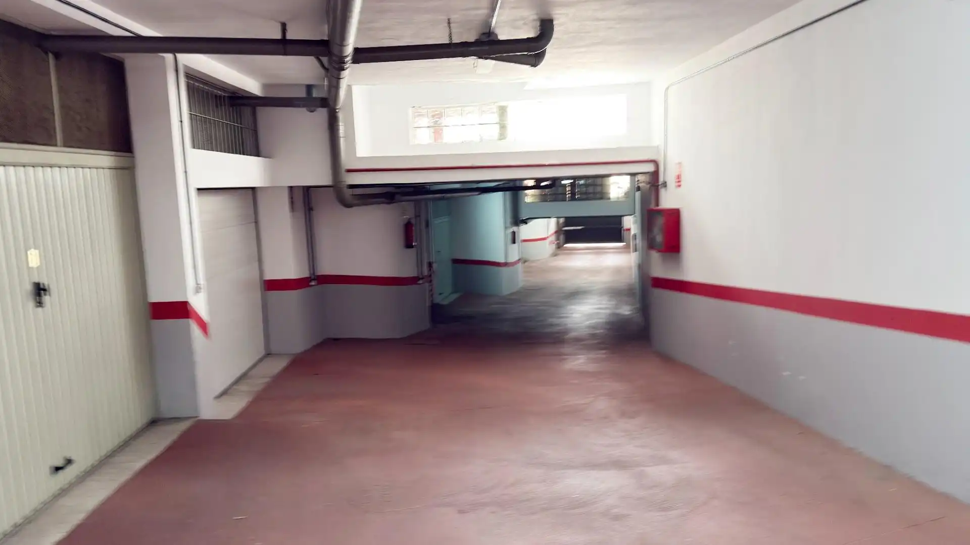 Parking de Casa adosada de alquiler en Punta Umbría con Terraza y Piscina comunitaria