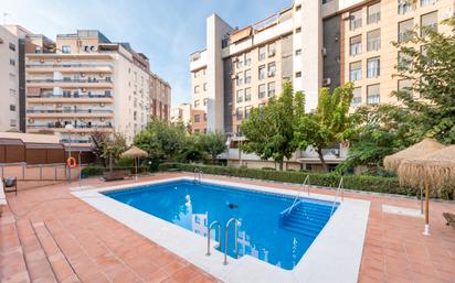 Swimming pool of Apartment for sale in  Granada Capital  with Heating, Private garden and Parquet flooring