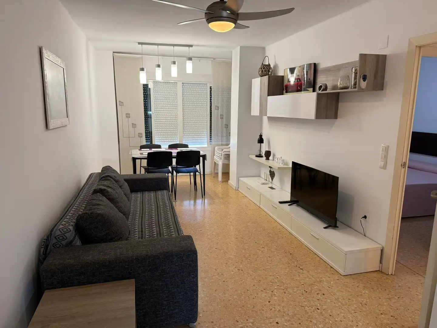 Sala d'estar de Apartament de lloguer en El Puig de Santa Maria amb Aire condicionat, Moblat i Piscina comunitària