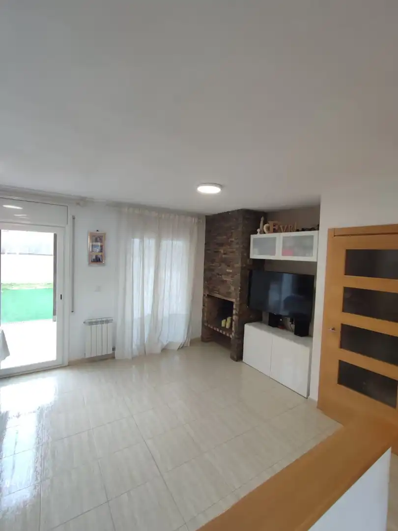 Sala de estar de Casa adosada en venta en Balaguer con Aire acondicionado, Calefacción y Jardín privado