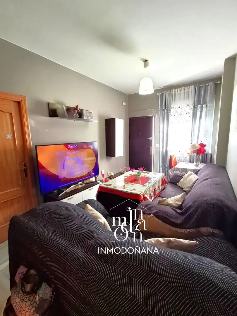 Sala de estar de Casa adosada en venta en Almonte con Aire acondicionado, Trastero y Piscina comunitaria