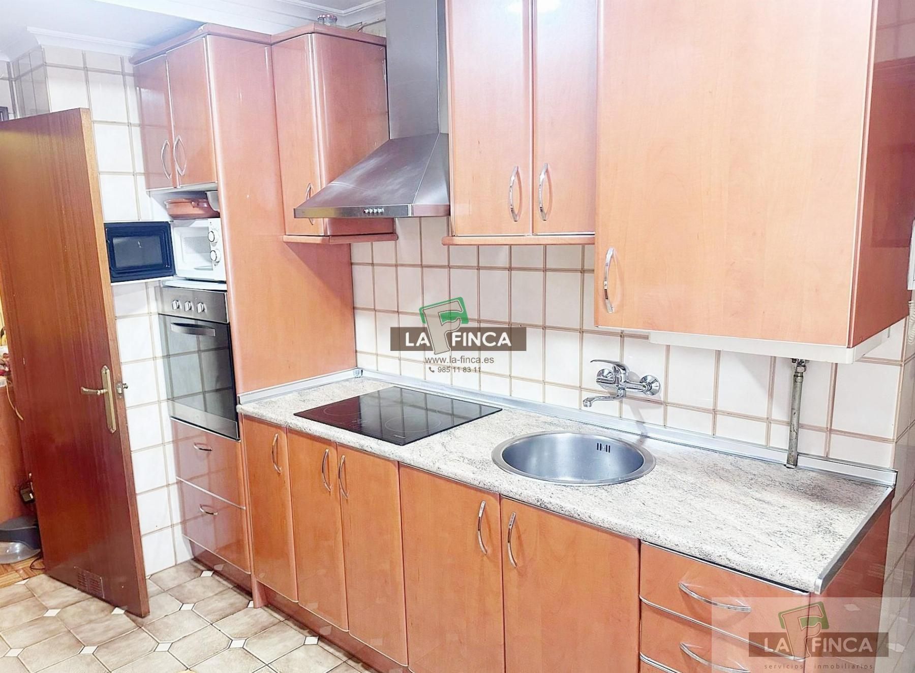 Kitchen of Flat for sale in Oviedo   with Heating, Parquet flooring and Storage room