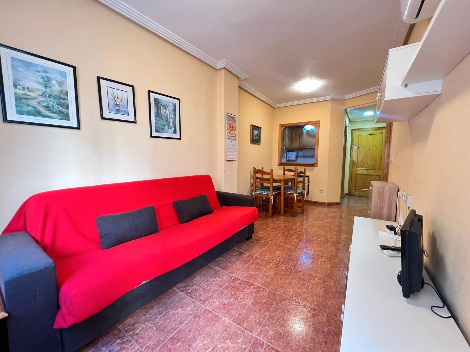 Living room of Flat for sale in Torrevieja  with Air Conditioner, Terrace and Furnished