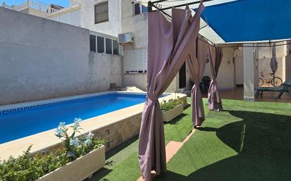 Swimming pool of House or chalet for sale in Torrevieja  with Air Conditioner, Heating and Private garden