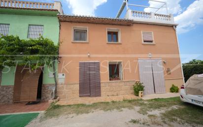 Exterior view of Single-family semi-detached for sale in Oliva  with Air Conditioner, Terrace and Storage room