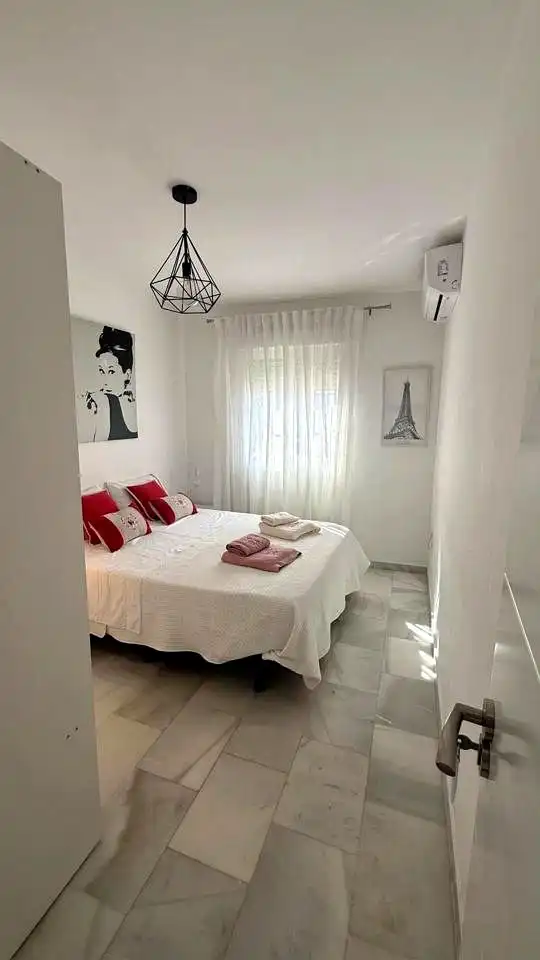 Habitación de Casa adosada en venta en Málaga con Aire acondicionado y Piscina comunitaria