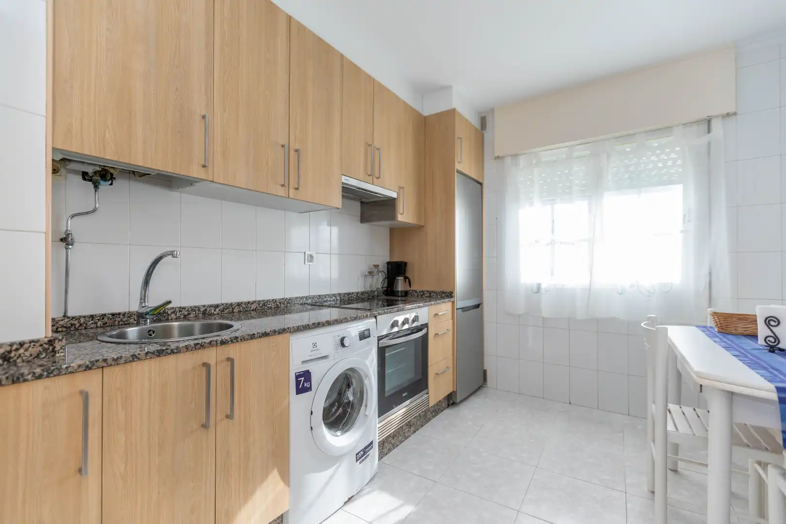 Cuina de Apartament en venda en Sanxenxo amb Calefacció, Terrassa i Moblat