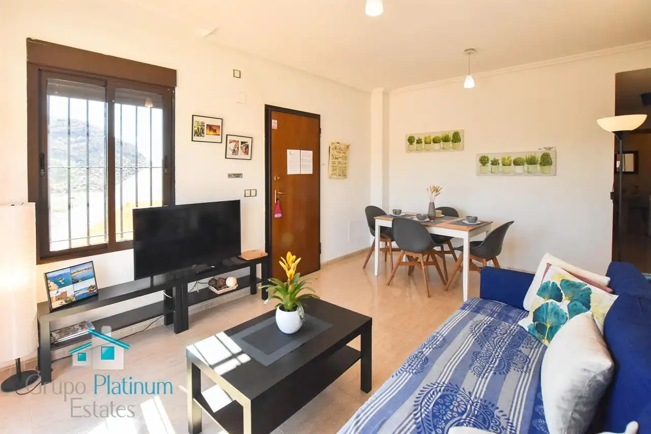 Sala d'estar de Apartament en venda en Pulpí amb Aire condicionat, Piscina i Moblat