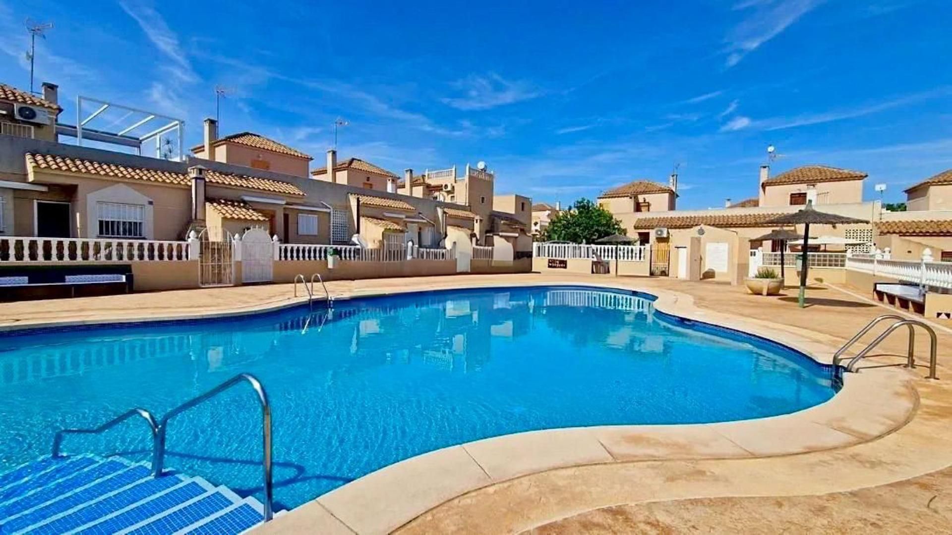 Swimming pool of Single-family semi-detached for sale in Torrevieja  with Air Conditioner, Private garden and Terrace