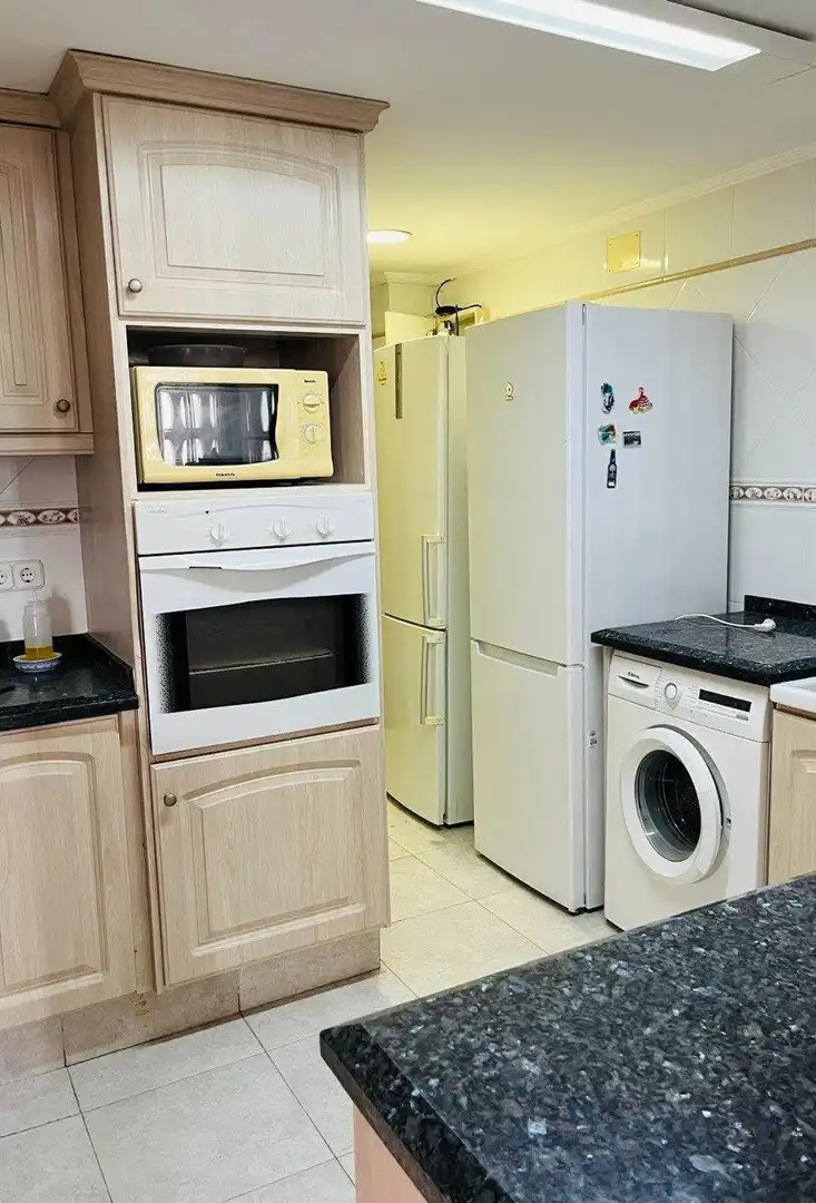 Kitchen of Flat for sale in Sueca  with Air Conditioner, Private garden and Storage room