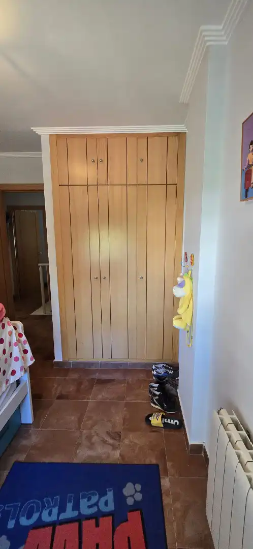 Habitación de Casa adosada en venta en El Portil con Calefacción, Trastero y Amueblado