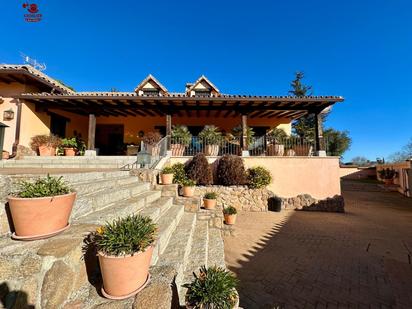 Exterior view of House or chalet for sale in Manzanares El Real  with Air Conditioner, Heating and Private garden