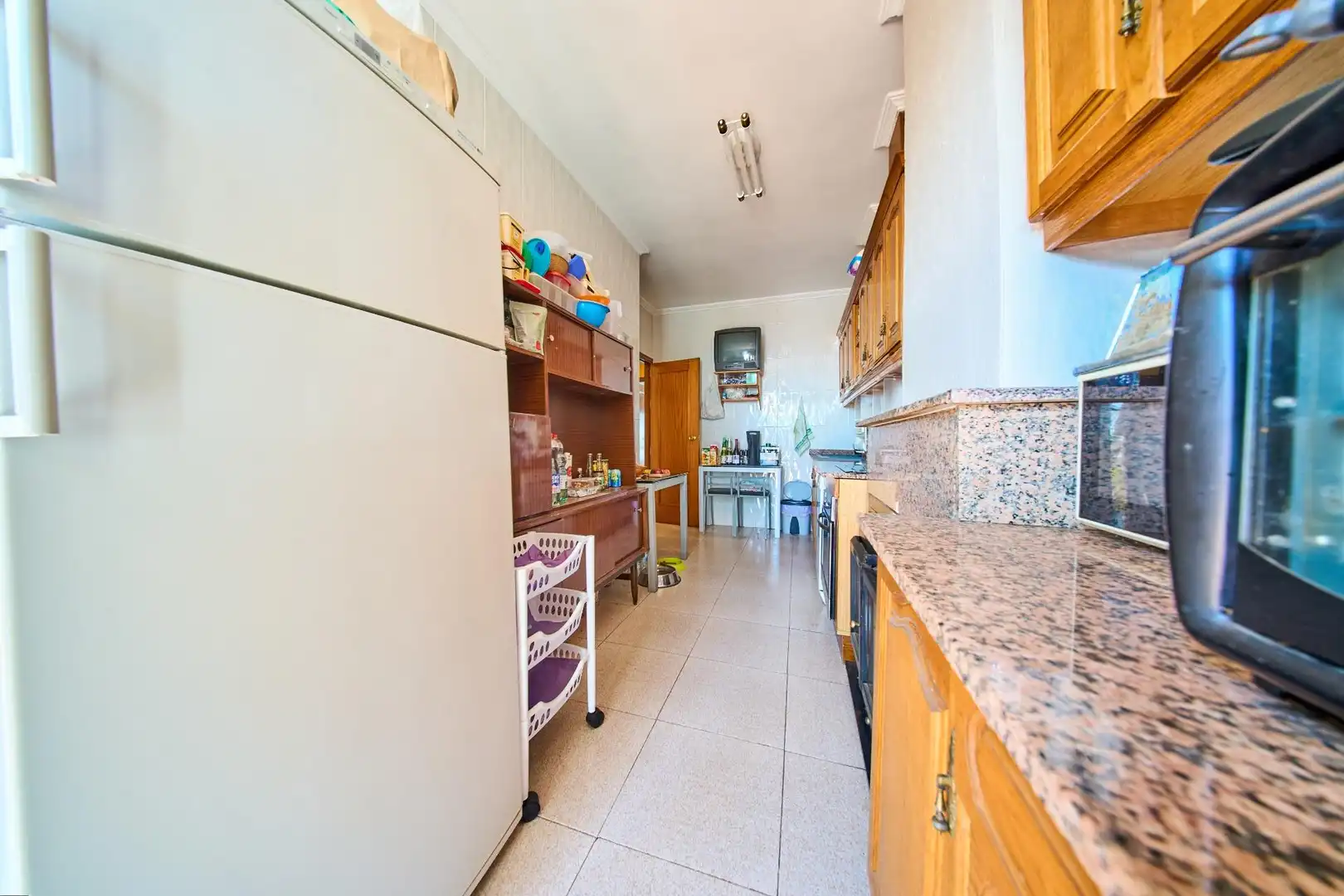 Cocina de Casa adosada en venta en Baza con Calefacción, Terraza y Trastero