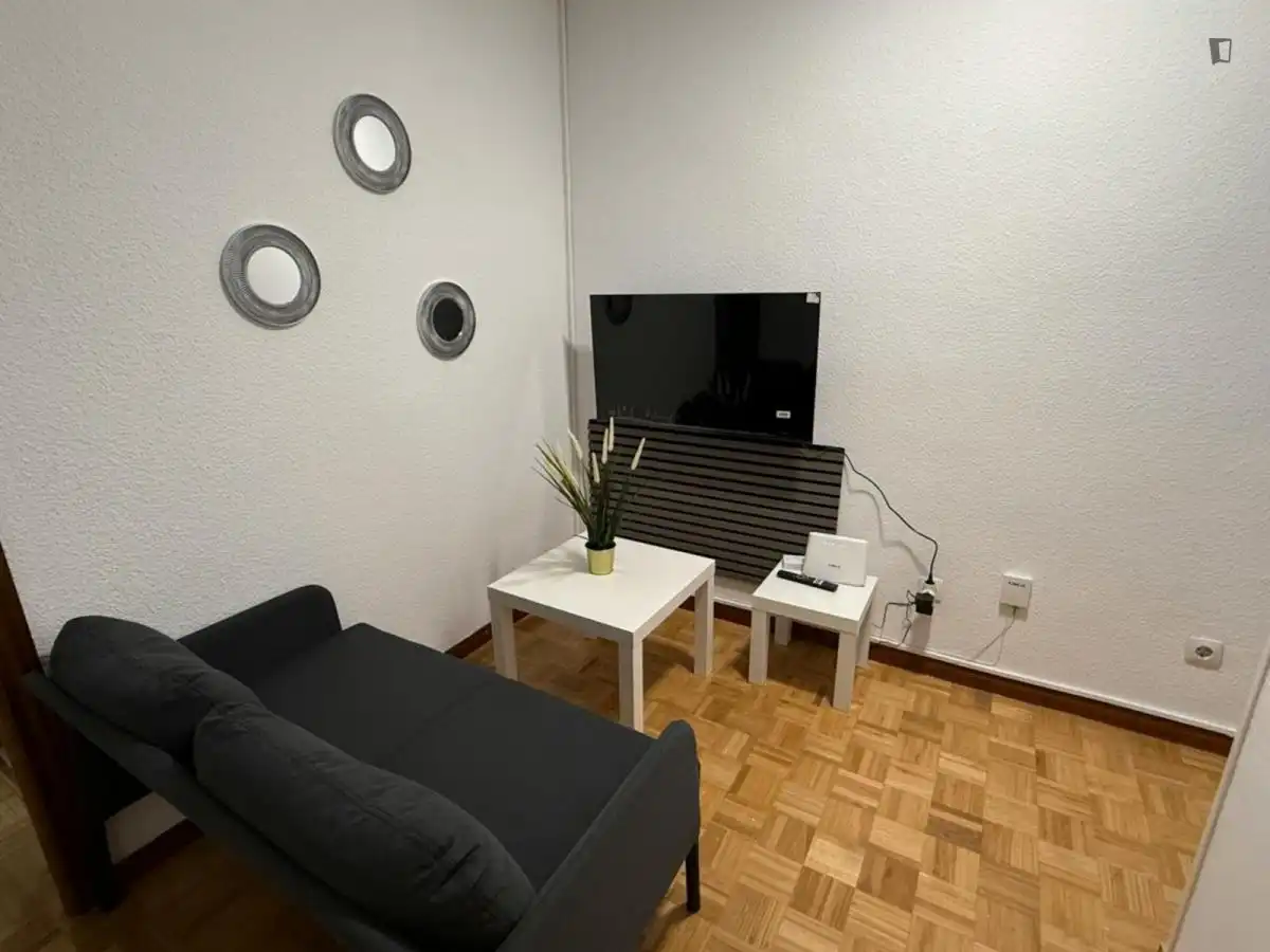 Sala de estar de Apartamento para compartir en Coslada con Aire acondicionado, Calefacción y Amueblado