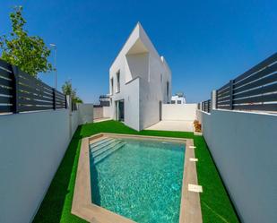 Swimming pool of Single-family semi-detached for sale in Benijófar  with Air Conditioner, Heating and Private garden