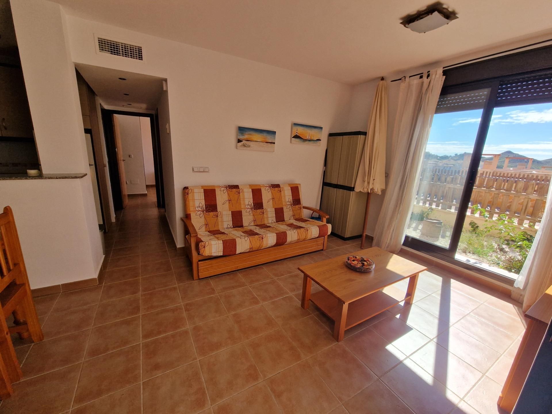 Sala d'estar de Apartament en venda en Águilas amb Aire condicionat, Jardí privat i Terrassa