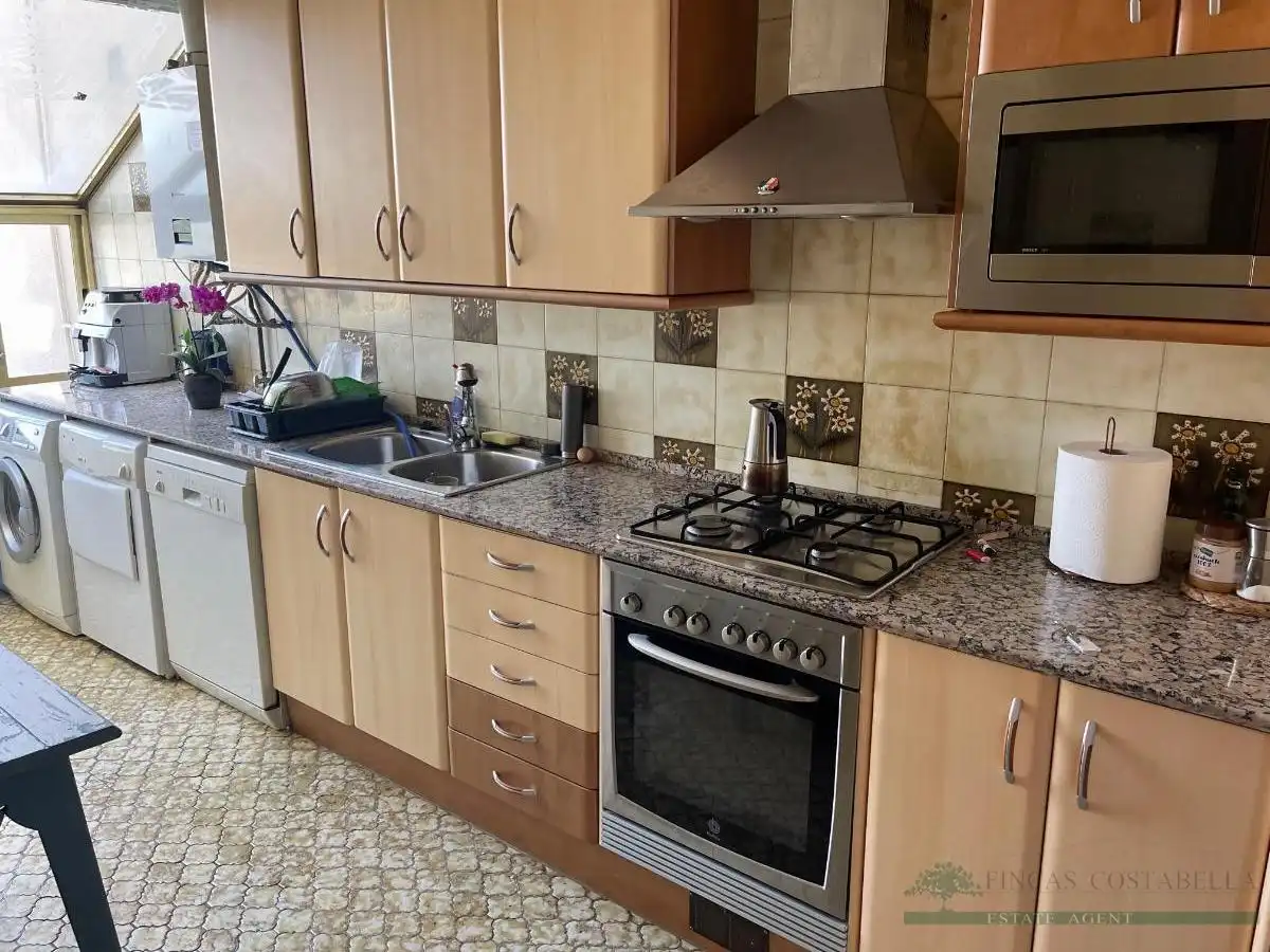 Cuina de Apartament en venda en Sant Feliu de Guíxols amb Calefacció, Terrassa i Piscina comunitària