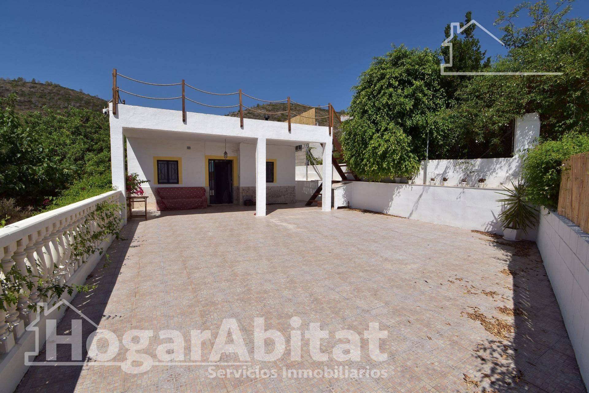Vista exterior de Casa o xalet en venda en Guadassuar amb Aire condicionat, Jardí privat i Terrassa
