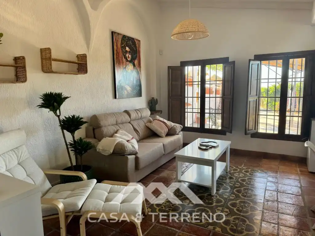 Sala d'estar de Casa o xalet en venda en Vélez-Málaga amb Aire condicionat, Jardí privat i Terrassa