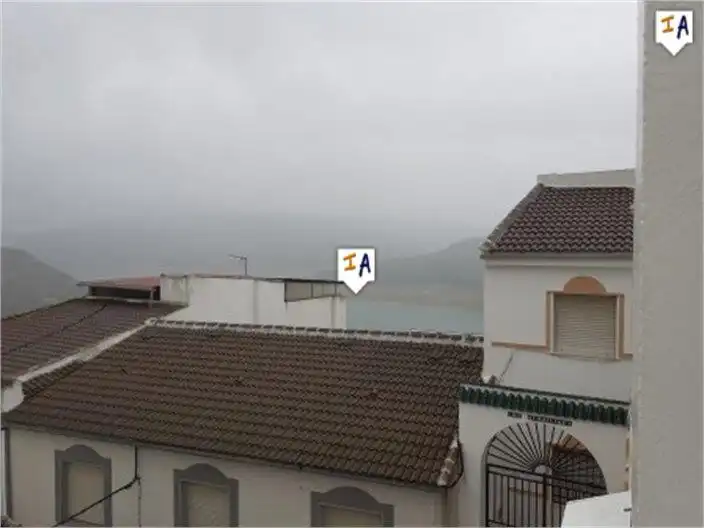 Dormitori de Casa adosada en venda en Iznájar amb Aire condicionat, Terrassa i Traster