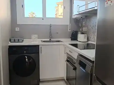 Cuina de Pis de lloguer en Cunit amb Aire condicionat