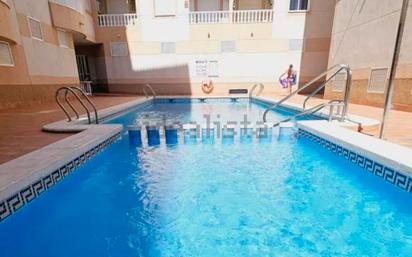 Swimming pool of Flat for sale in Torrevieja  with Air Conditioner, Heating and Furnished