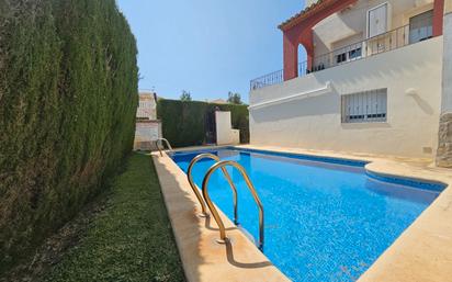 Swimming pool of Single-family semi-detached for sale in Oliva  with Air Conditioner, Heating and Terrace