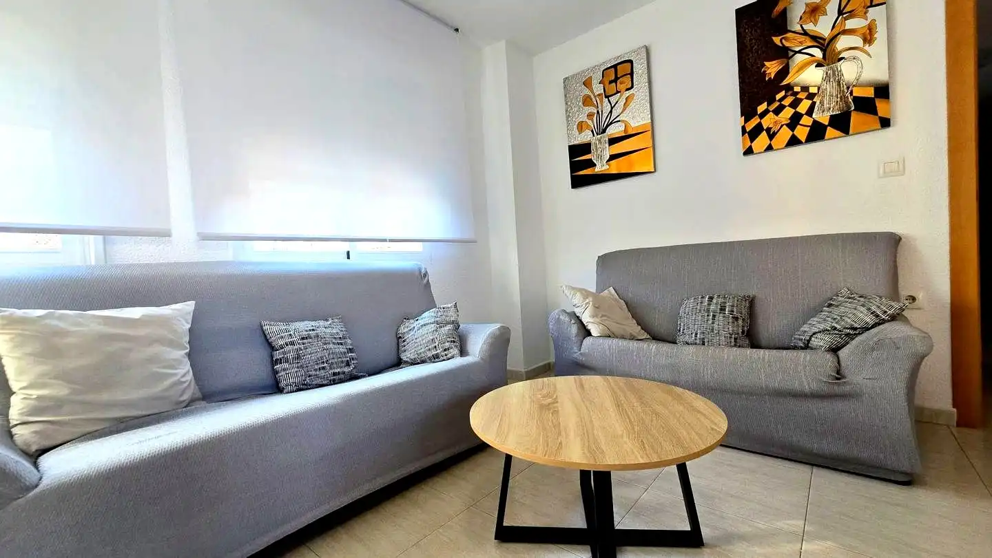 Sala de estar de Apartamento de alquiler en Gandia con Aire acondicionado, Terraza y Piscina comunitaria