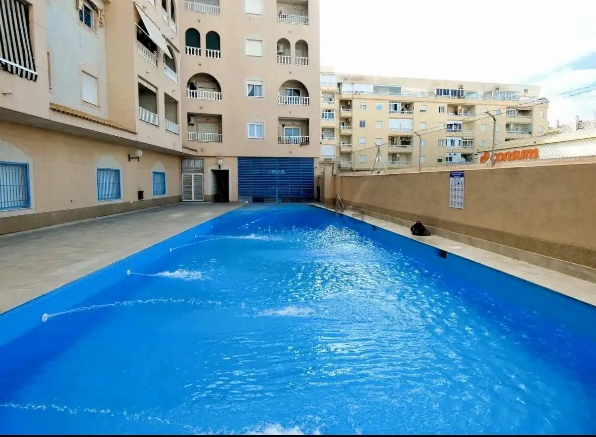 Swimming pool of Ground floor for sale in Torrevieja  with Air Conditioner, Terrace and Community pool