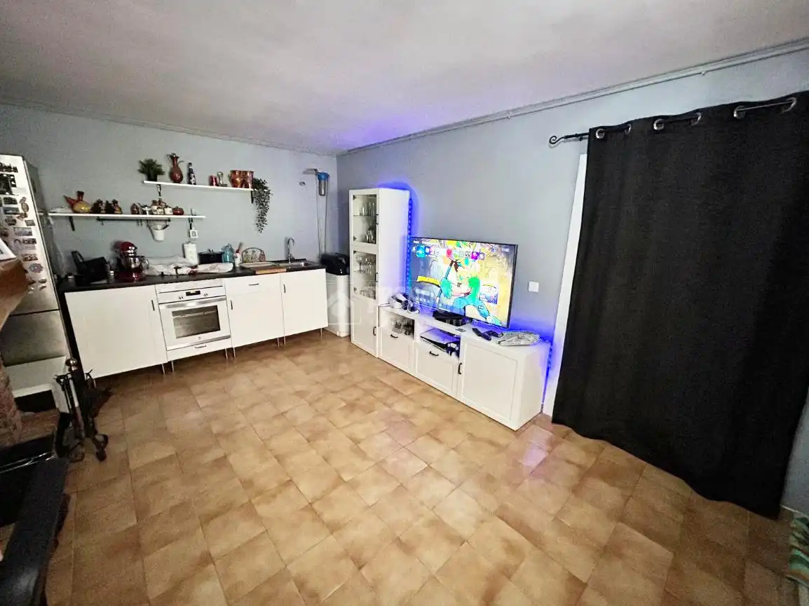 Sala d'estar de Casa adosada en venda en La Puebla de Alfindén amb Calefacció