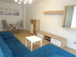 Sala d'estar de Pis de lloguer en Gijón  amb Calefacció, Parquet i Moblat