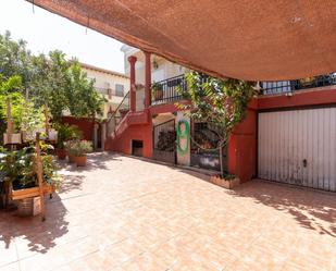 Exterior view of Single-family semi-detached for sale in Vegas del Genil  with Air Conditioner and Terrace