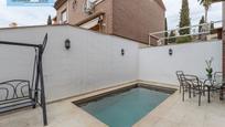 Swimming pool of Single-family semi-detached for sale in  Granada Capital  with Heating, Private garden and Terrace