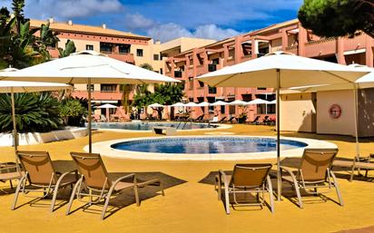 Piscina de Apartament de lloguer en Punta Umbría amb Aire condicionat, Calefacció i Jardí privat