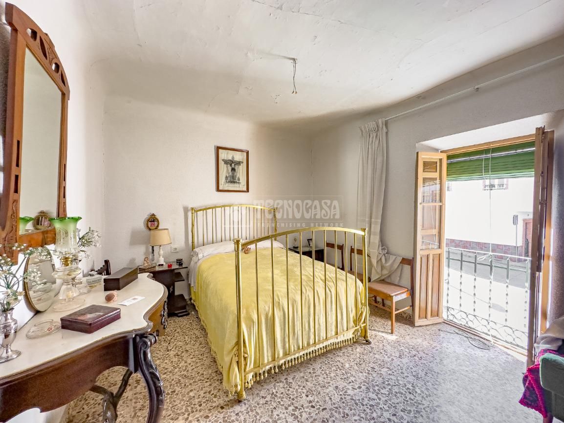 Dormitori de Casa adosada en venda en Vegas del Genil amb Jardí privat